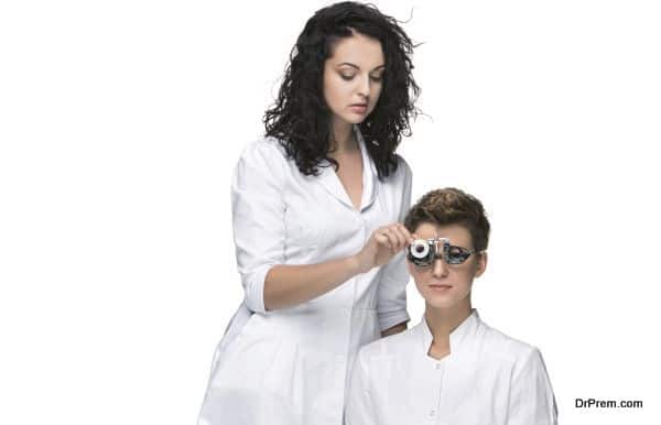 Optometrist Examines the sight of young girl