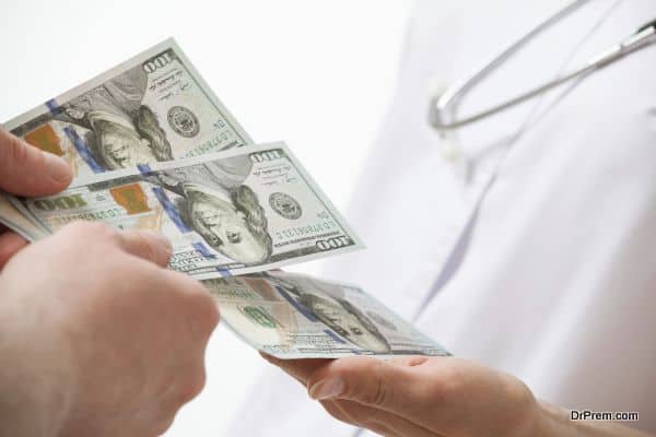 Patient's hand giving a money to doctor