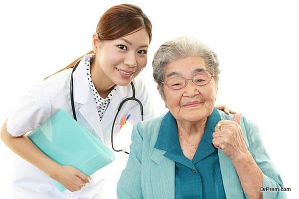 Smiling doctor and senior woman