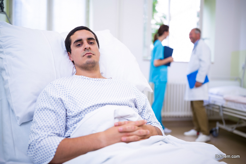 Ill patient lying on bed in hospital