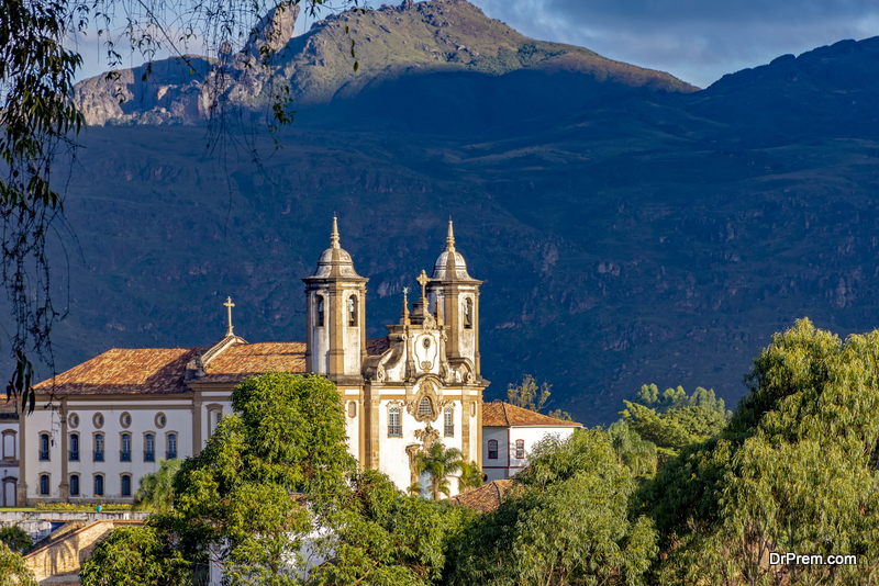 Ancient historical catholic church and hill in downtow of Ouro Preto city