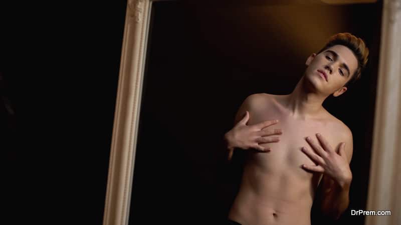 Male transgender touching body 