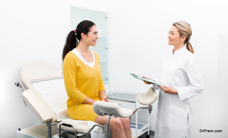 Patient sitting in a gynecological chair during a consultation with her attending gynecologist in a modern clinic. Women's health, uterus