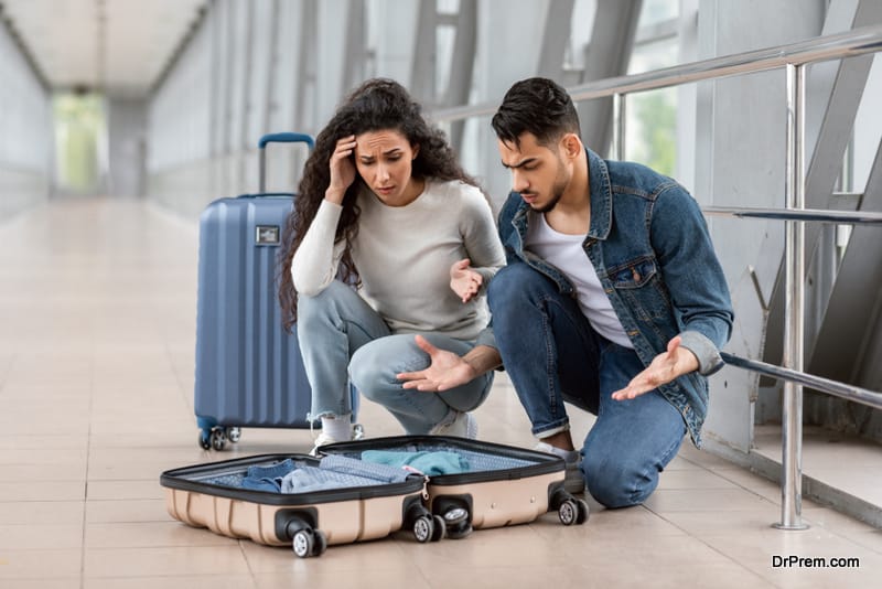 Confused young couple lost luggage Items