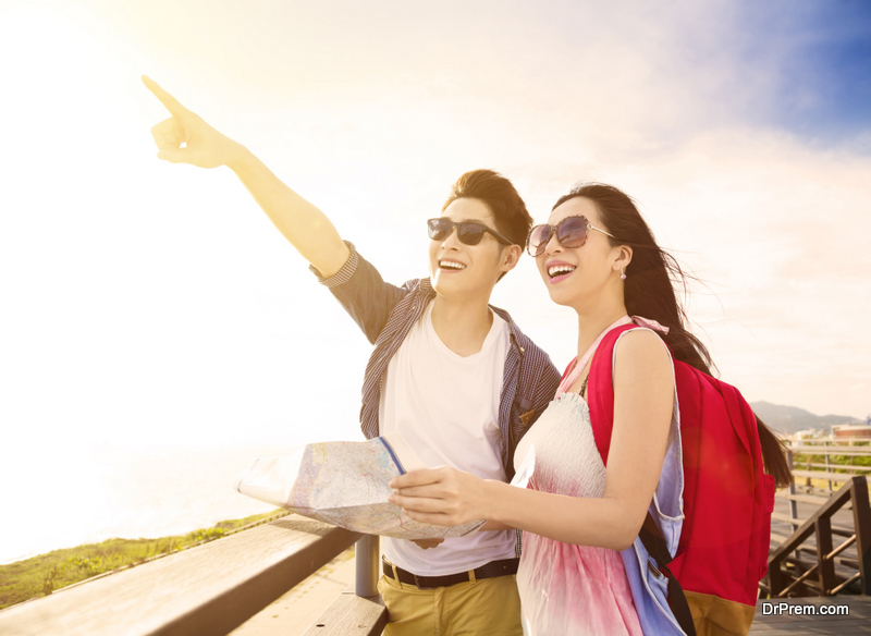 Happy young couple on vacation and looking at view