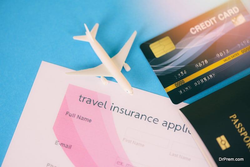 Travel insurance application form with passport credit cards airplane flight travel traveller fly travelling citizenship air boarding pass travel business trip