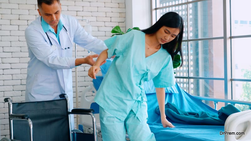 Doctor in professional uniform examining patient at hospital or medical clinic