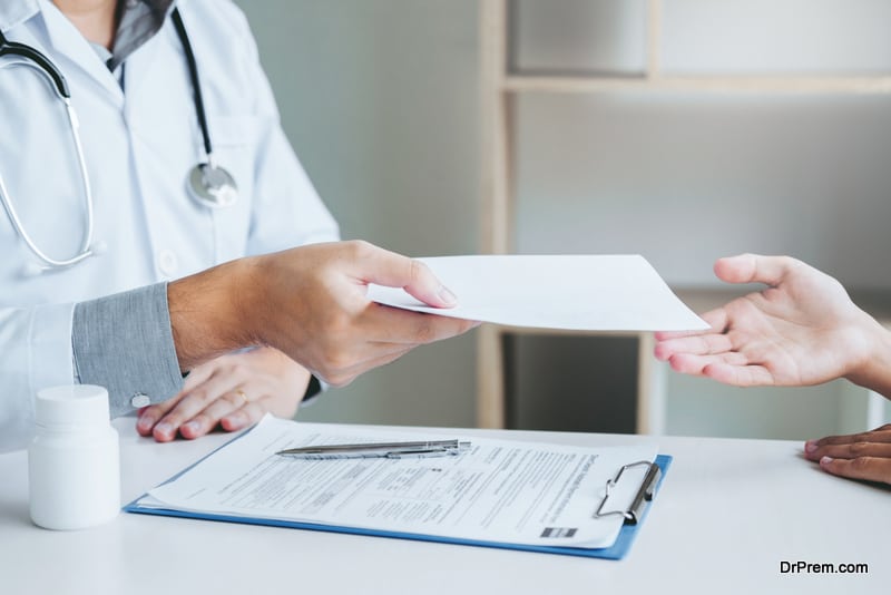 woman receiving medical certificate