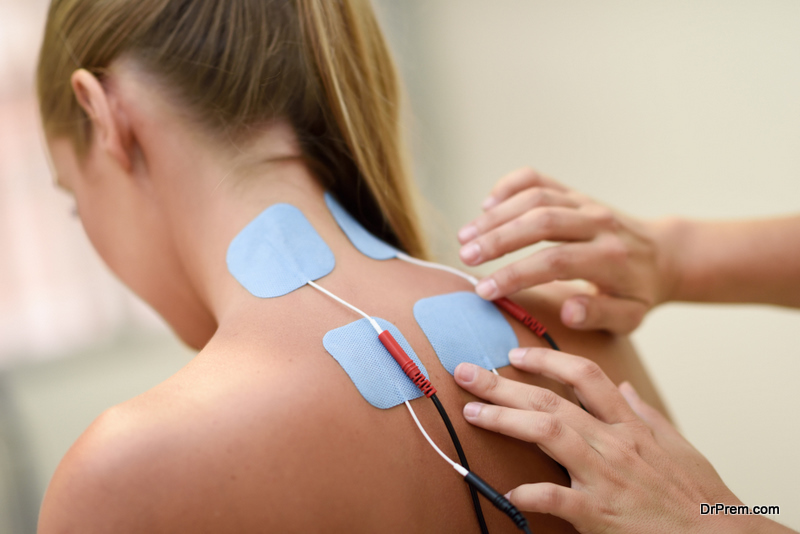 Electro stimulation in physical therapy to a young woman