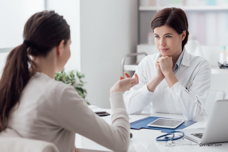 woman getting information from doctor