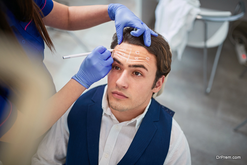 Man with markings on face for enhancing beauty and correcting defects 