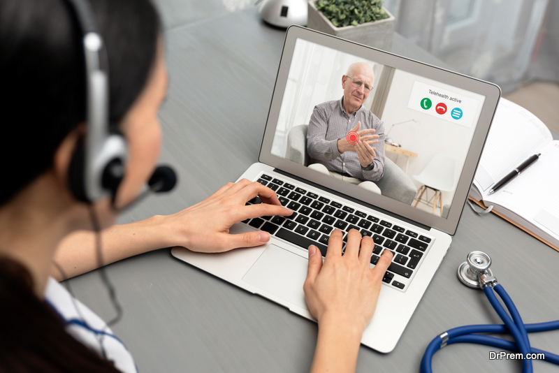 Doctor talking with a senior patient. Telemedicine concept