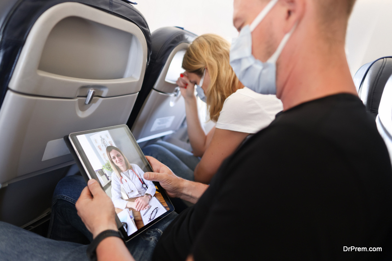Man receives medical advice on video call while sitting on airplane