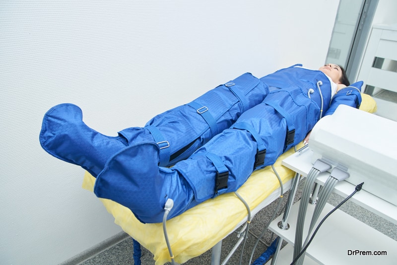 liposuction blue pressotherapy. Doctor help lose weight and slimming. Model at costume in salon.