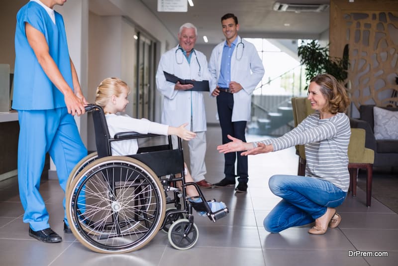 Happy mother meeting her disable daughter in hospital corridor