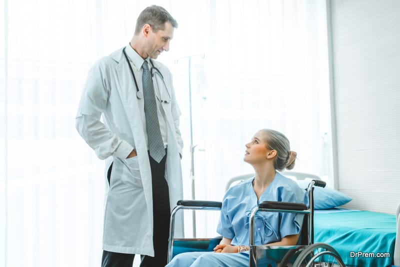 Doctor in professional uniform examining patient at hospital or medical clinic