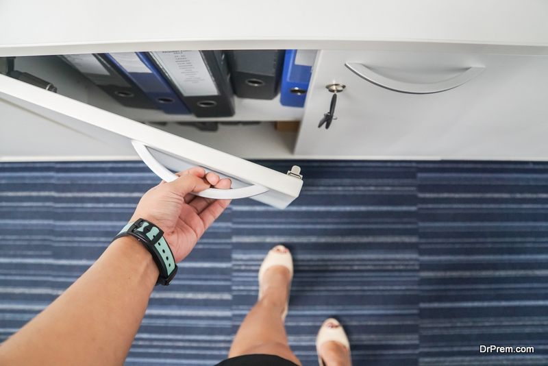 close up businesswoman hand open the office cabinet for documents and folders