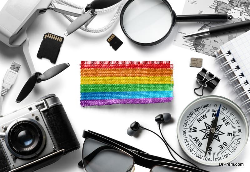 flag-of-lgbt-and-travel-accessories-on-a-white-background