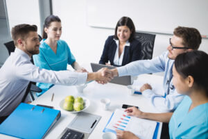 Dr Prem on Hosted Buyers in Medical Tourism Growth- Lessons from 15-Country Delegation in Mumbai doctors shaking hands with each other
