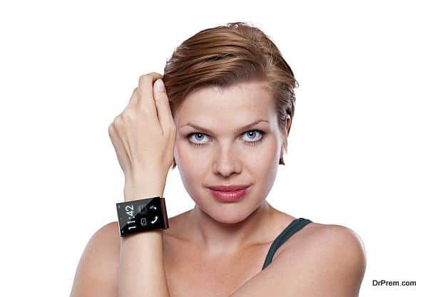 Girl with an Internet Smart Watch isolated on white