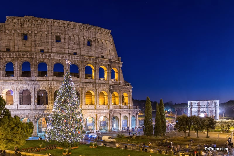 Roman Colosseum at night with Christmas tree