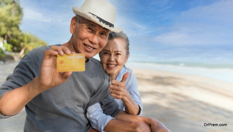 couple showing ATM card during tour