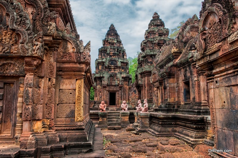 The temple built in red sandstone was forgotten for centuries and rediscovered 1814 in the jungle of the Angkor area of Cambodia