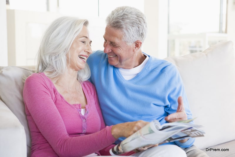 Couple with a magazine smiling