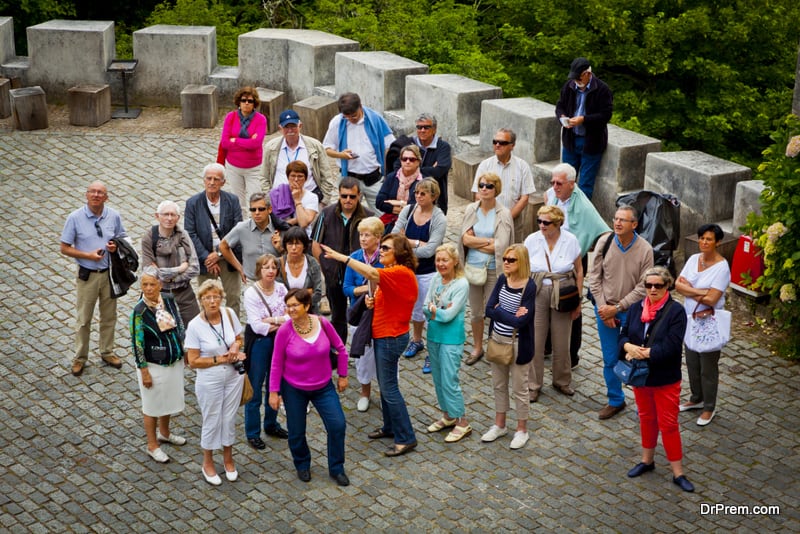 Group of tourists listening to the guide