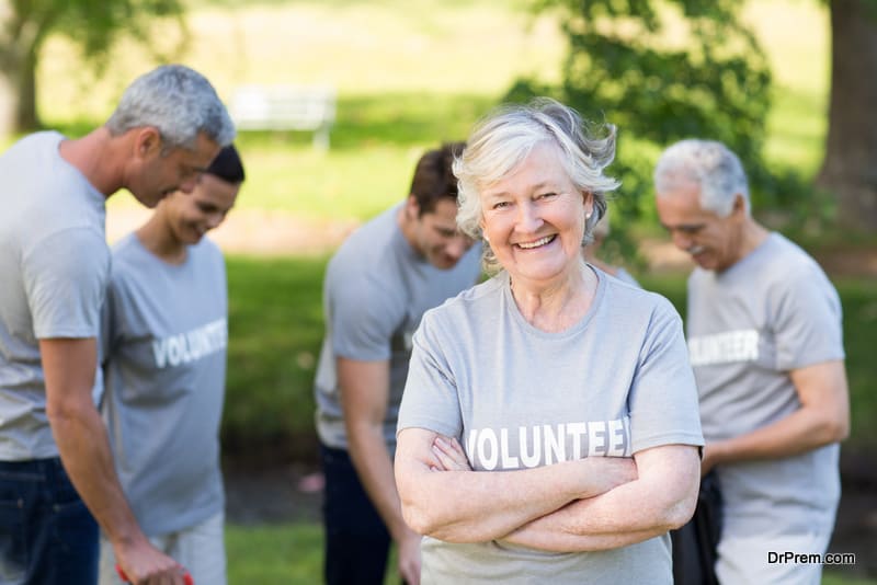 Happy volunteer grandmother smiling at camera