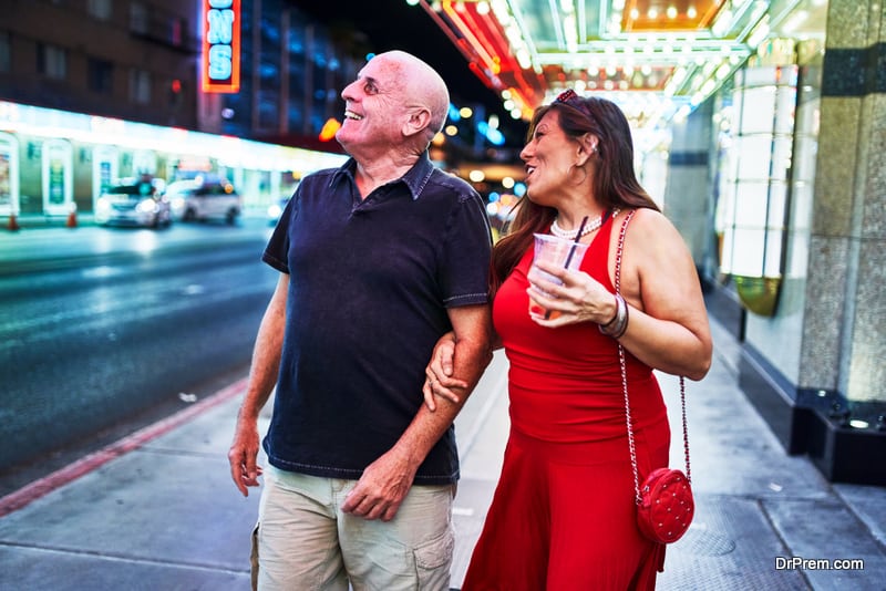 mature couple sightseeing in downtown las vegas streets