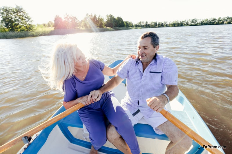 Retired couple spending time on a boat together