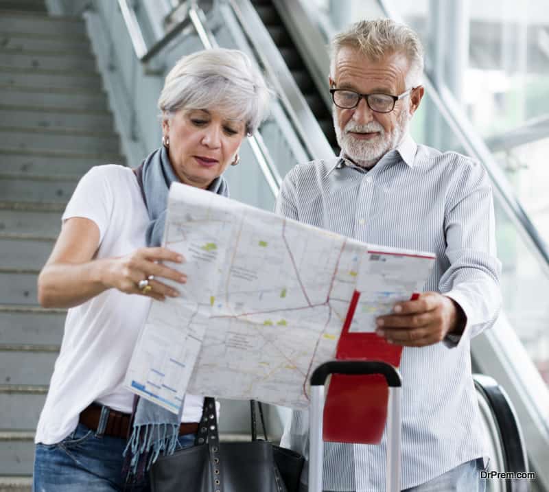 Senior couple tourists traveling city