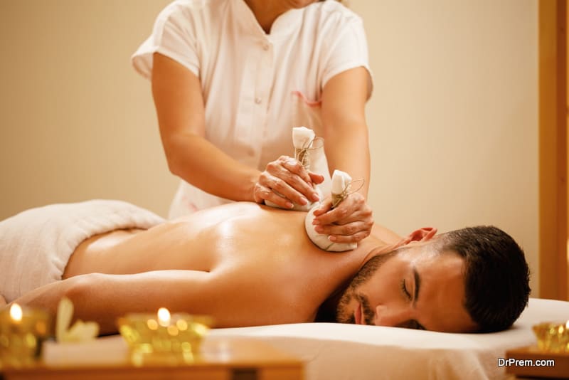 Relaxed man enjoying in back massage 