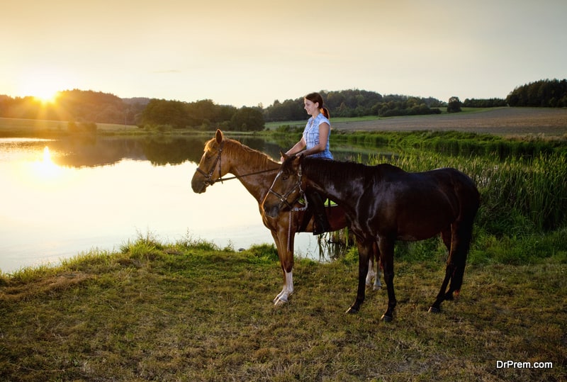 woman got an opportunity of a horse ride around the periphery of the lake