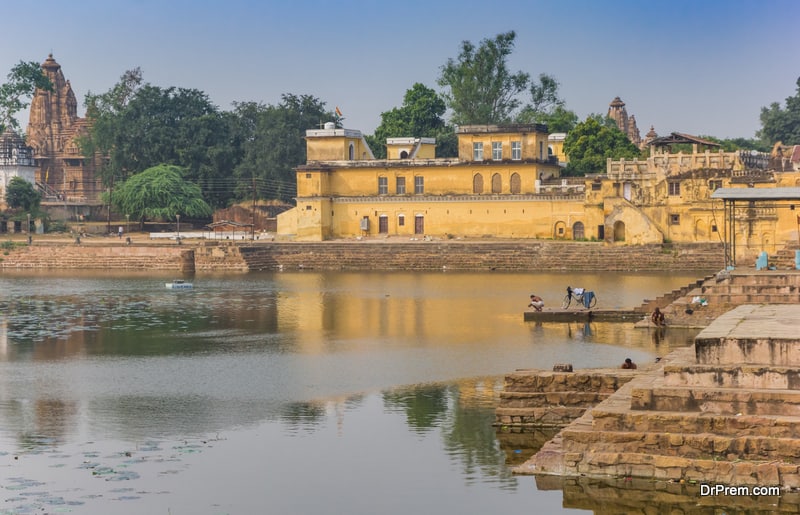 Historic buildings at the Shivasagar lake in Khajuraho