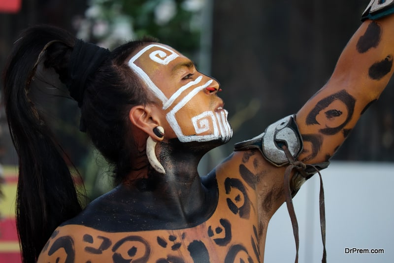 Ancient Mayan warrior in combat coloring of a leopard on historical festival in Moscow