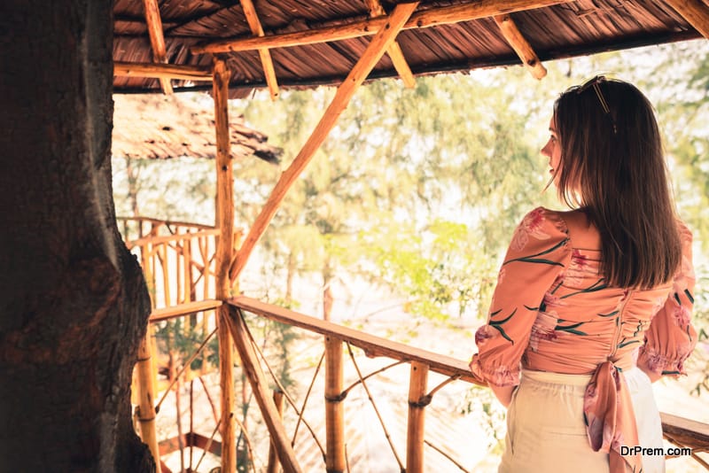 Woman relaxing in bamboo hut