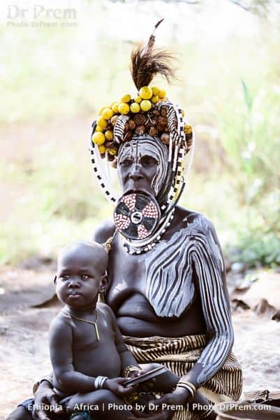Mursi female with her child