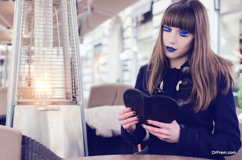 Alone girl in restaurant looking menu