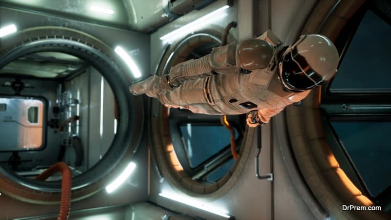 An astronaut in zero gravity checks the module of his spaceship. View of the spacecraft with an astronaut.