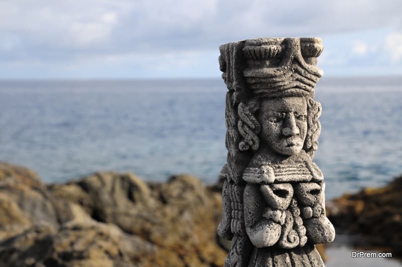 Ancient Maya Statue on the Rocks