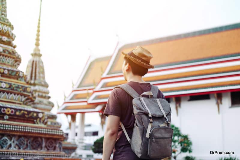 Asian-traveling-backpacker-in-Wat-Pho-in-Bangkok-Thailand