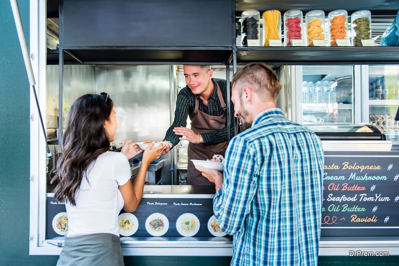 Couple buying pasta from food truck