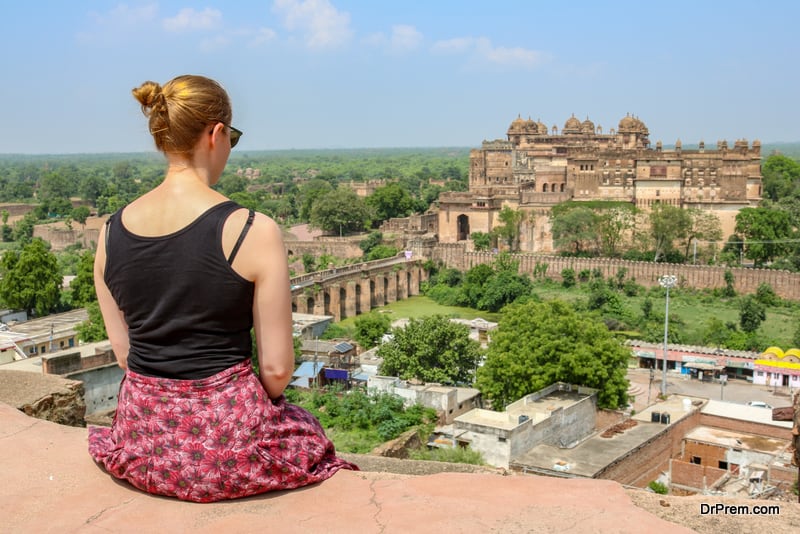 Female-tourist-woman-enjoying-the-view-over-Orchha-and-the-Orchha-Palace-India