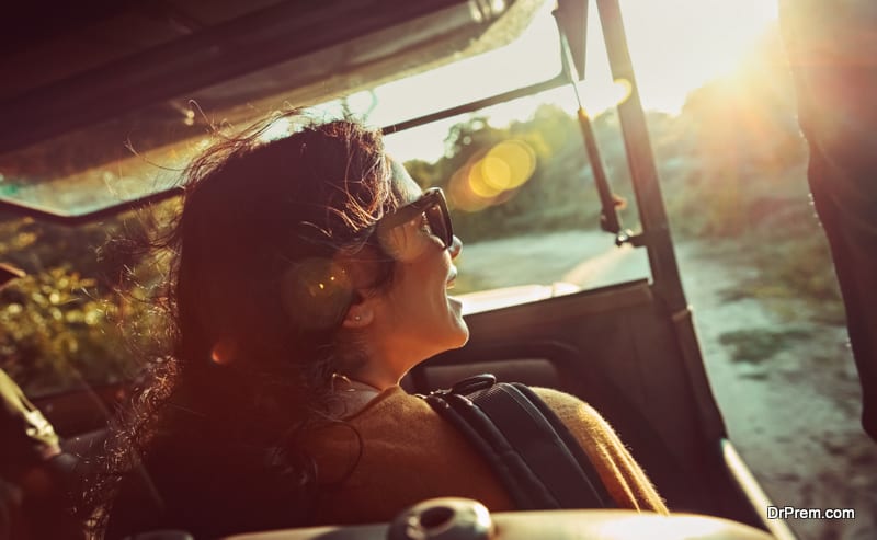 Happy woman on safari ride