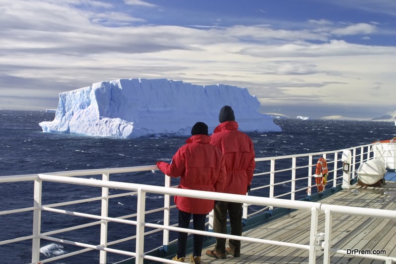 Turists viewing iceberg, Antarctica