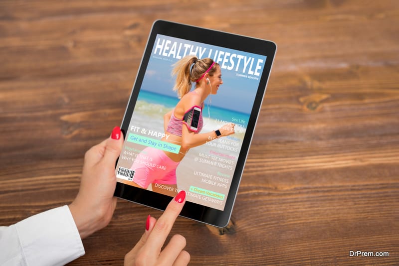 Woman reading healthy lifestyle magazine on tablet 