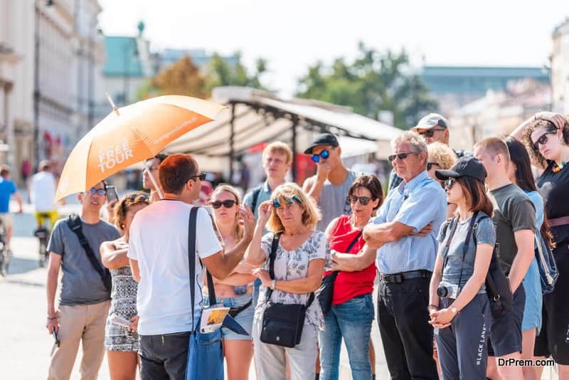 group of travellers with tour guide 