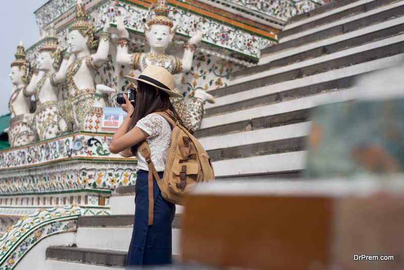 Young Asian women tourist taking photo picture with camera